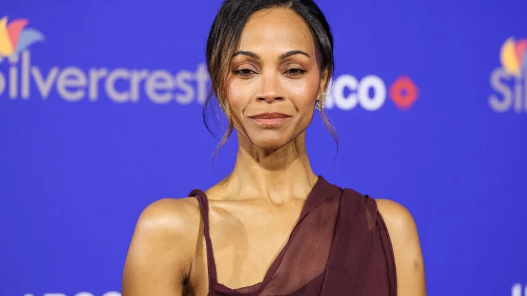 Zoe Saldaña Turns Heads in Sheer White Corset with Lace Bra and Bold Peplum