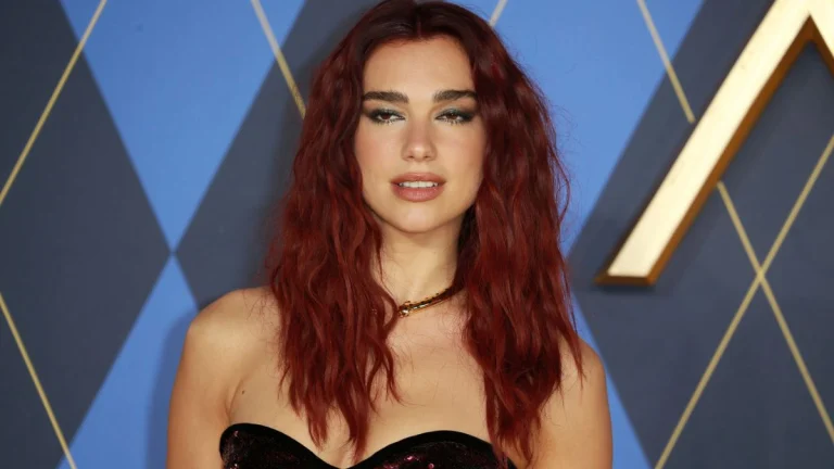 Dua Lipa Commands the Spotlight in a Plunging Blue Mermaid Gown That Leaves Little to the Imagination