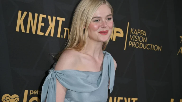 Elle Fanning Slips Into Glossy Pink Satin and Barely-There Feathers in Playful, High-Fashion Vogue Spain Spread