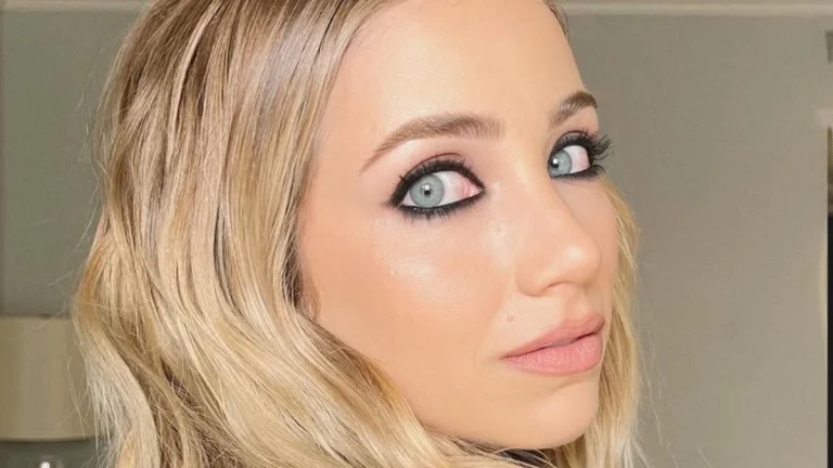 Emily Rudd Commands Attention in Sleek Grey Suit at Press Event