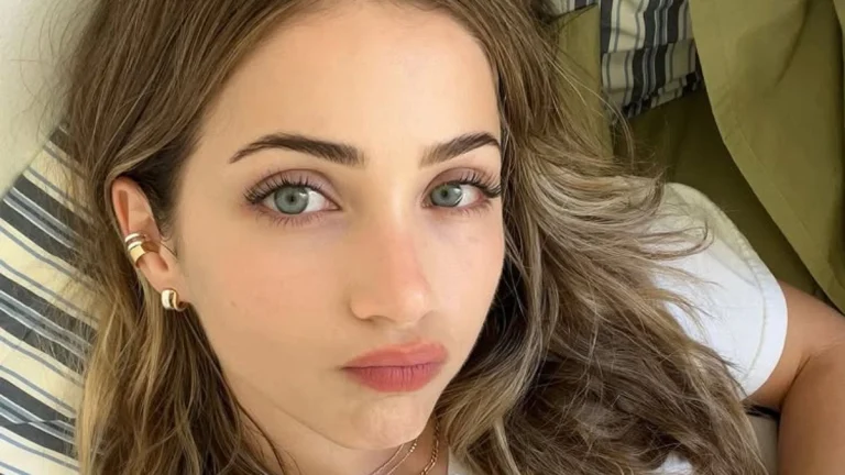 Emily Rudd Dazzles in Blush Pink While Rocking Luscious Golden Waves