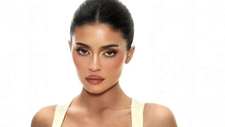 Kylie Jenner Shows Off Her Perfectly Curved Backside in Tiny Peach Bikini in Throwback Beach Snap