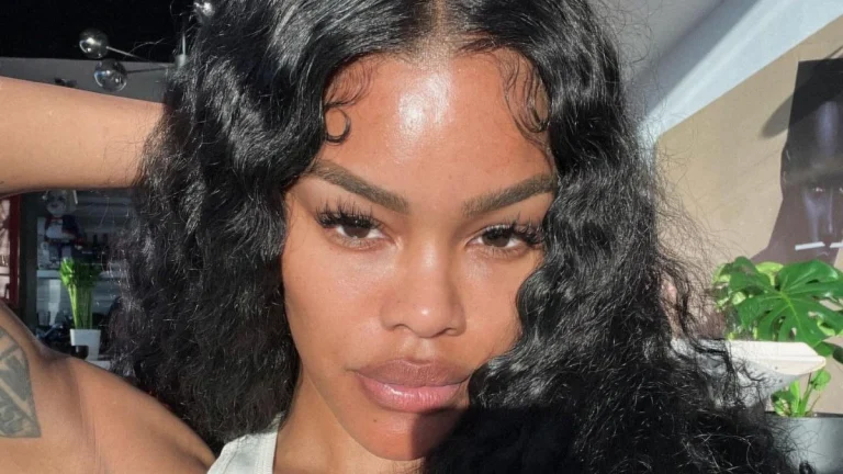 Teyana Taylor Stuns in Icy Blonde Bob and Transparent Coat at Chanel