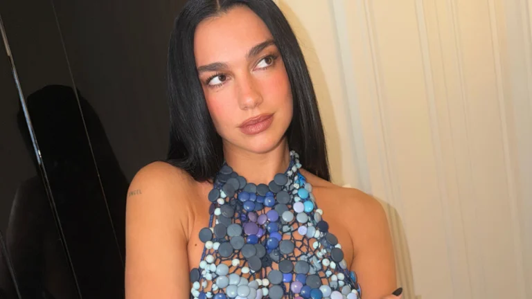 ‘Barbie’ Star Dua Lipa Brings Feathered Drama to Chanel’s Front Row in a Flaming Red Floral Look